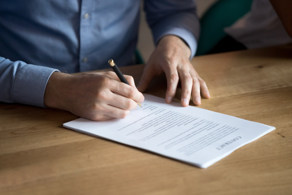 Man signing a Document